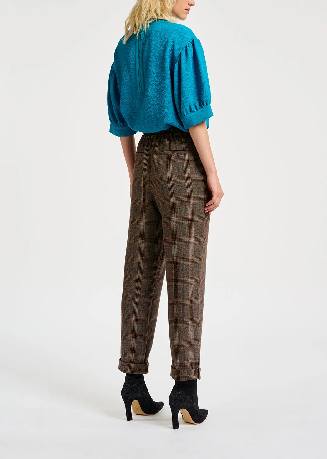 Brown pants with black and blue check motif