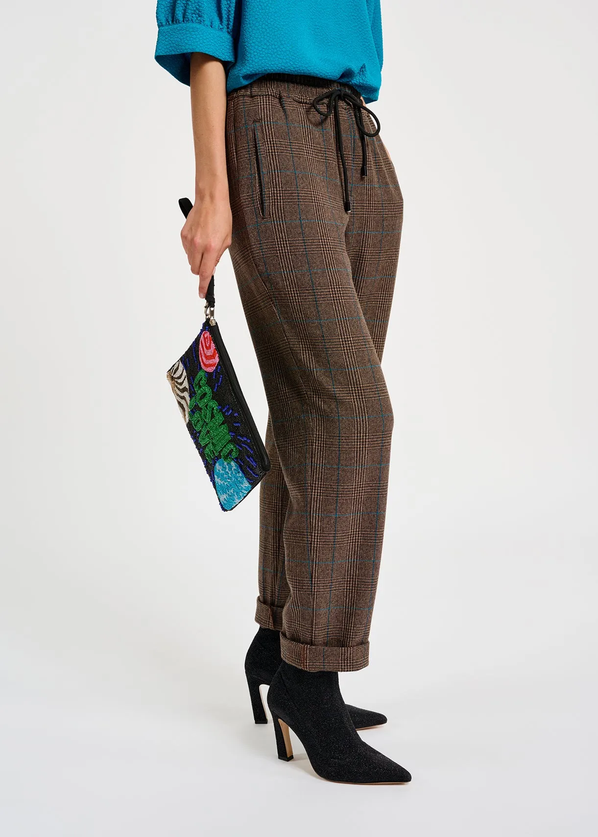 Brown pants with black and blue check motif