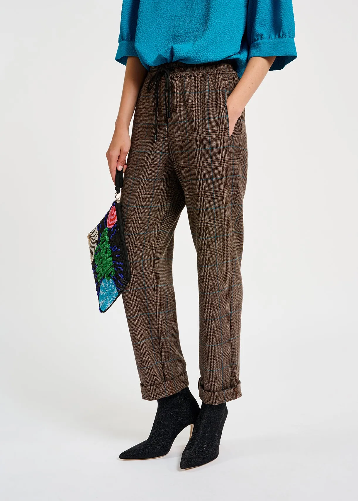 Brown pants with black and blue check motif