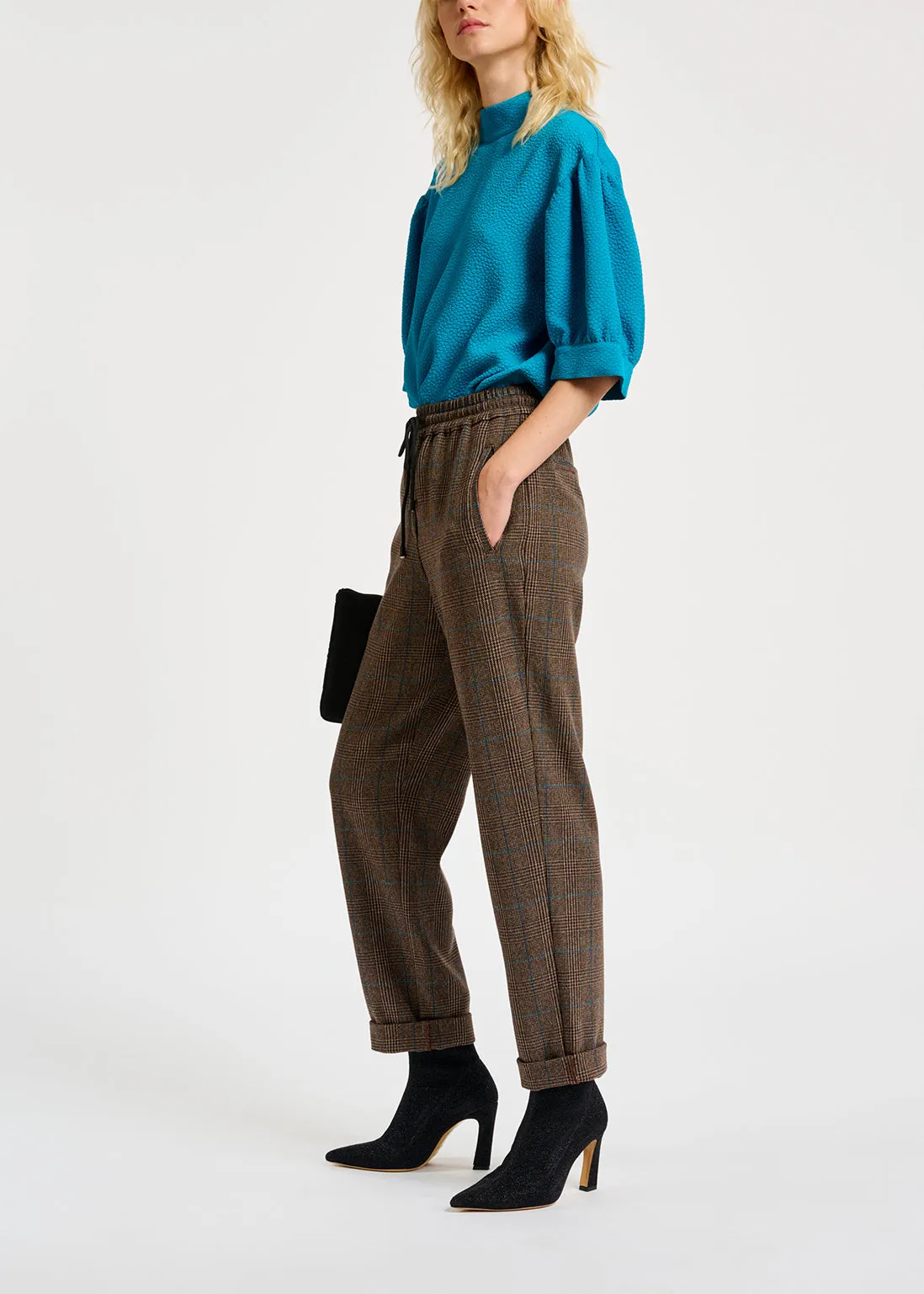 Brown pants with black and blue check motif