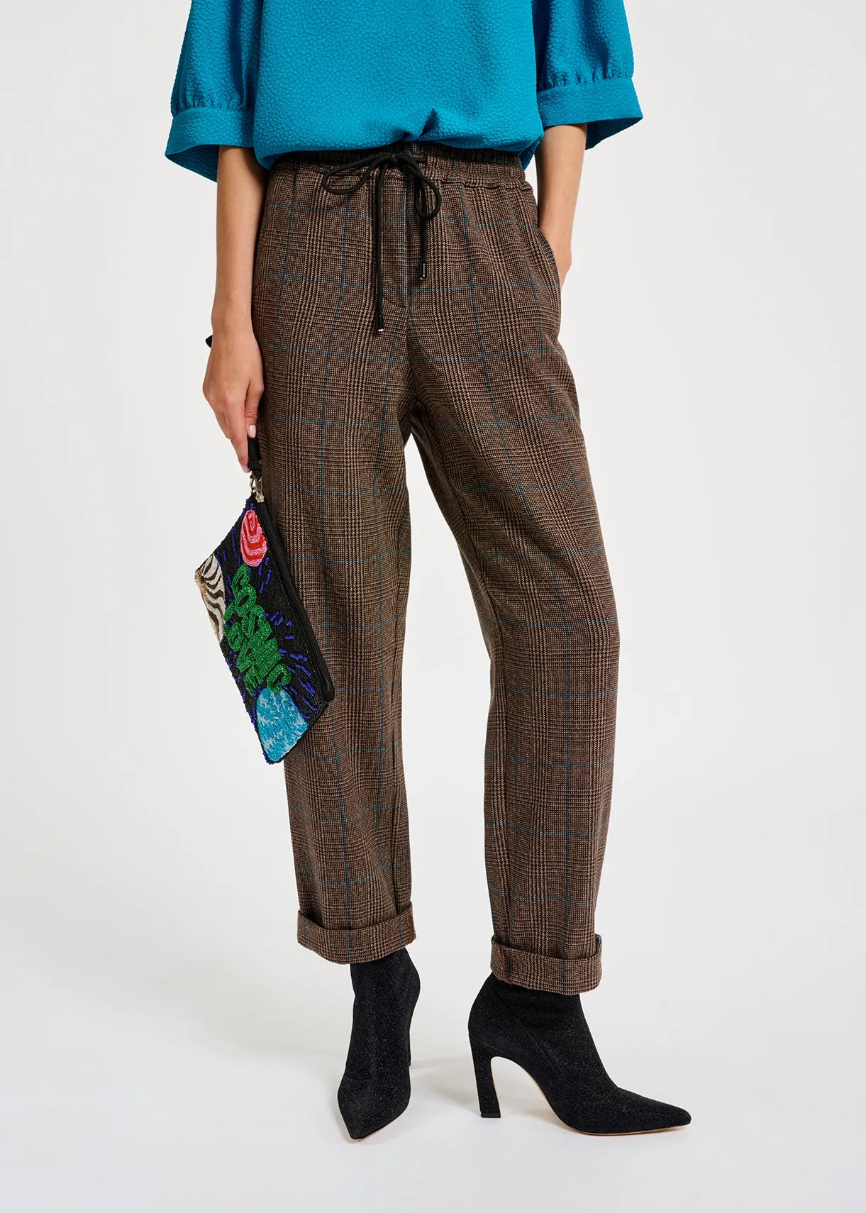 Brown pants with black and blue check motif