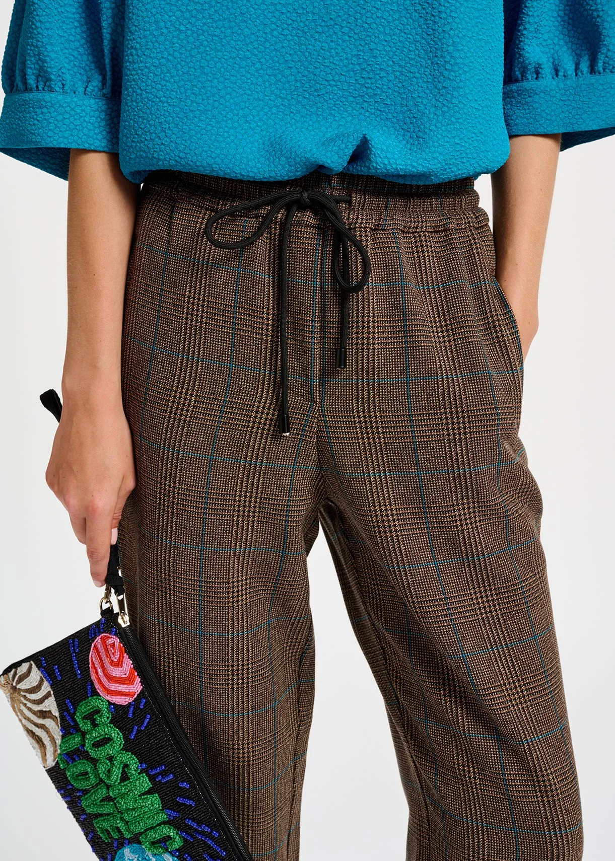 Brown pants with black and blue check motif