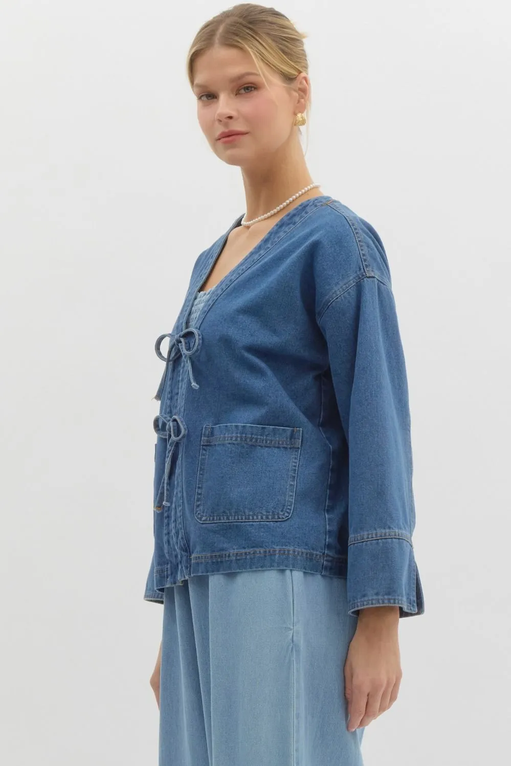 Denim jacket featuring front bow tie