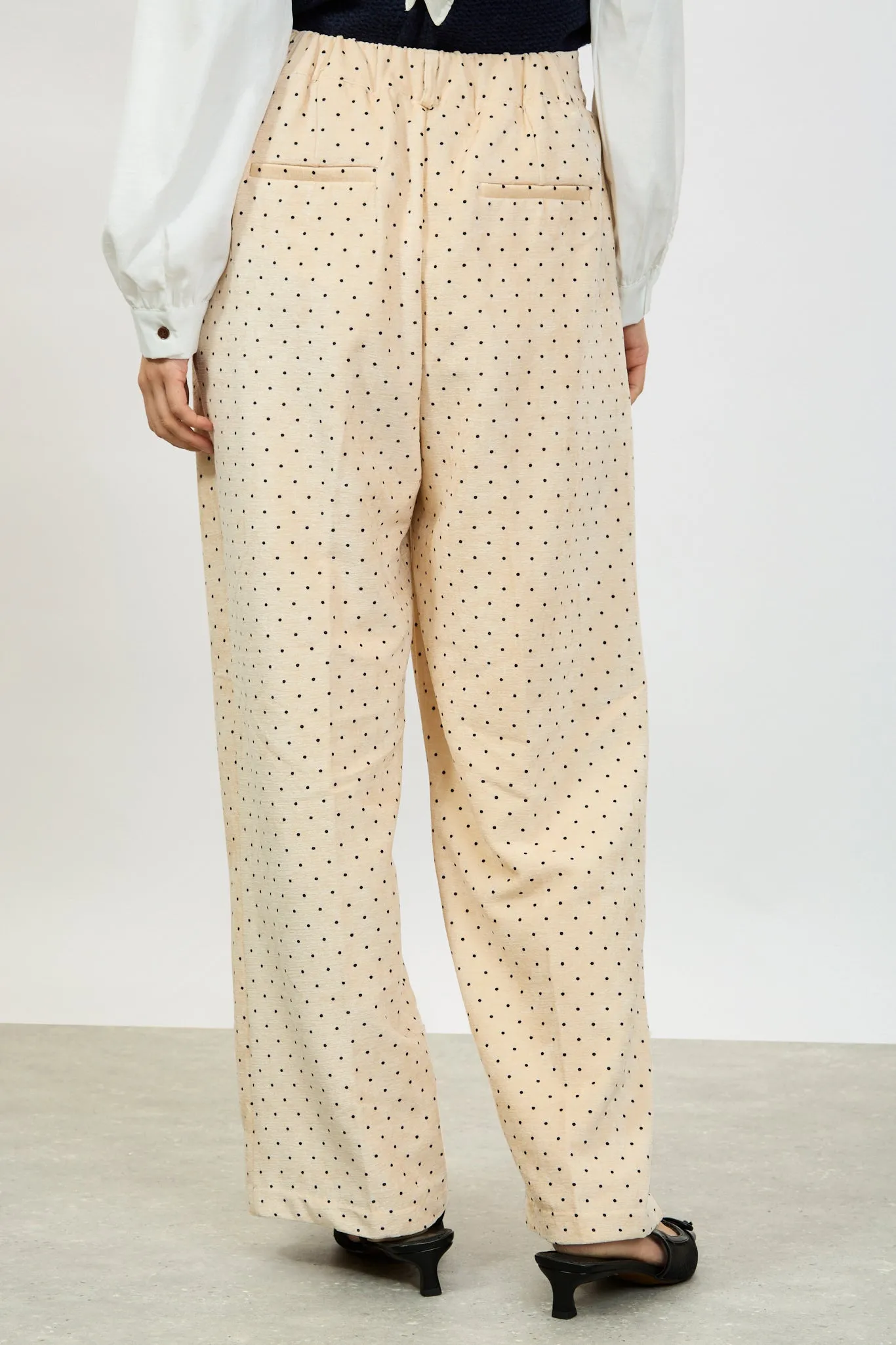 Ivory polka dot flap pocket trousers