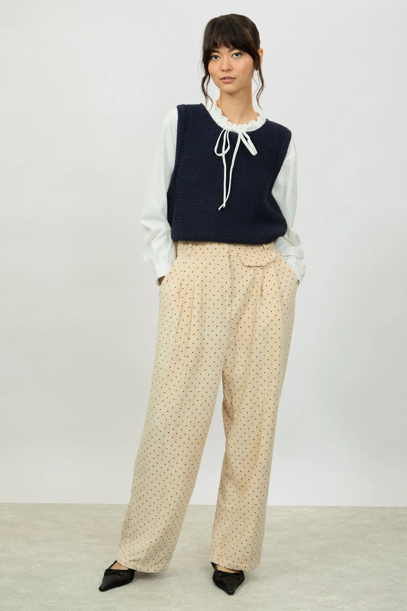 Ivory polka dot flap pocket trousers