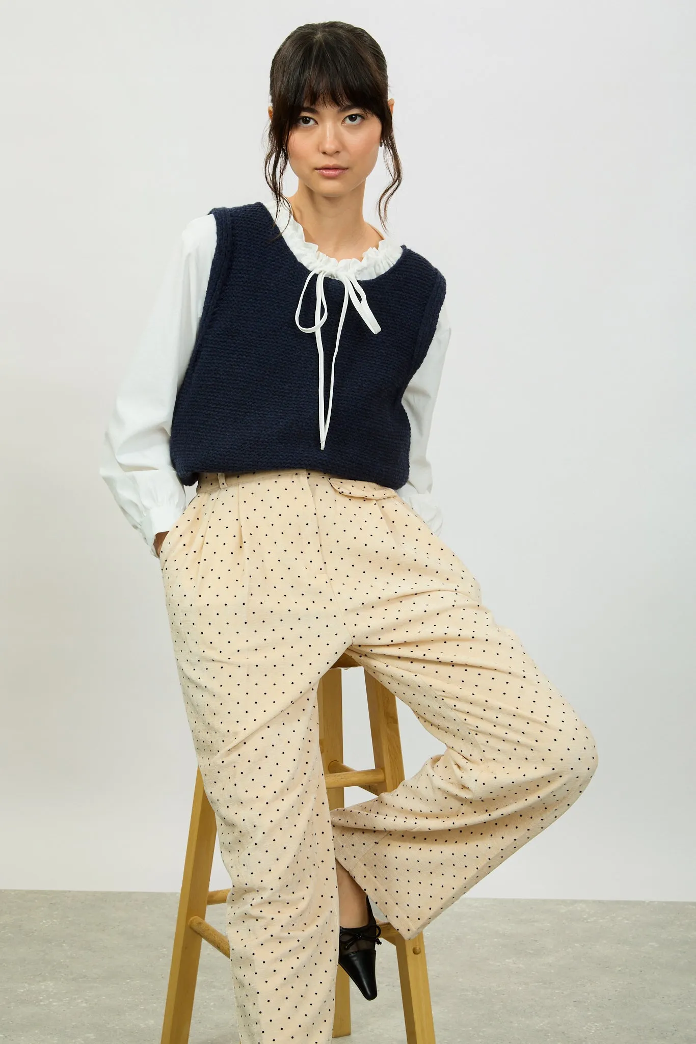 Ivory polka dot flap pocket trousers