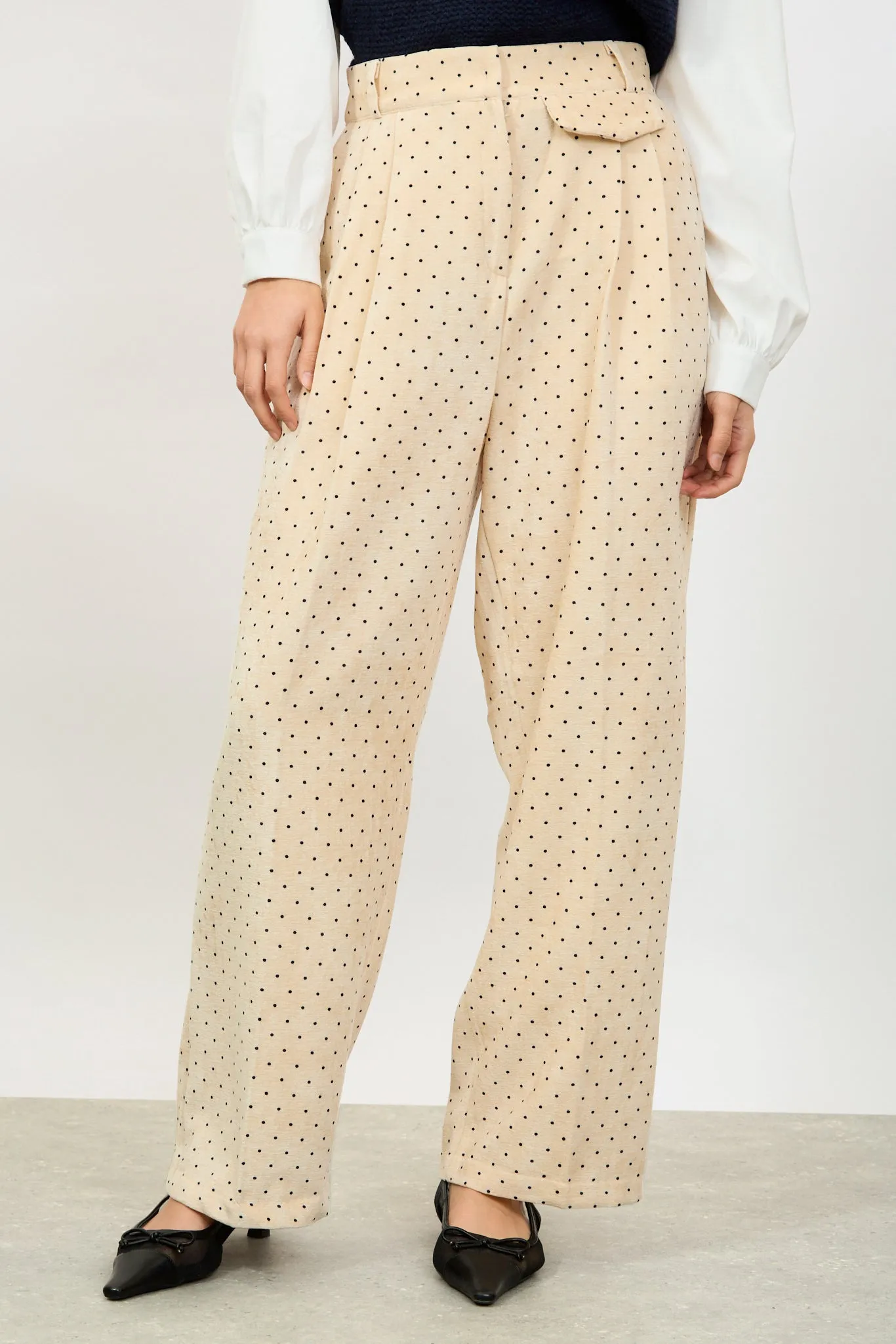 Ivory polka dot flap pocket trousers