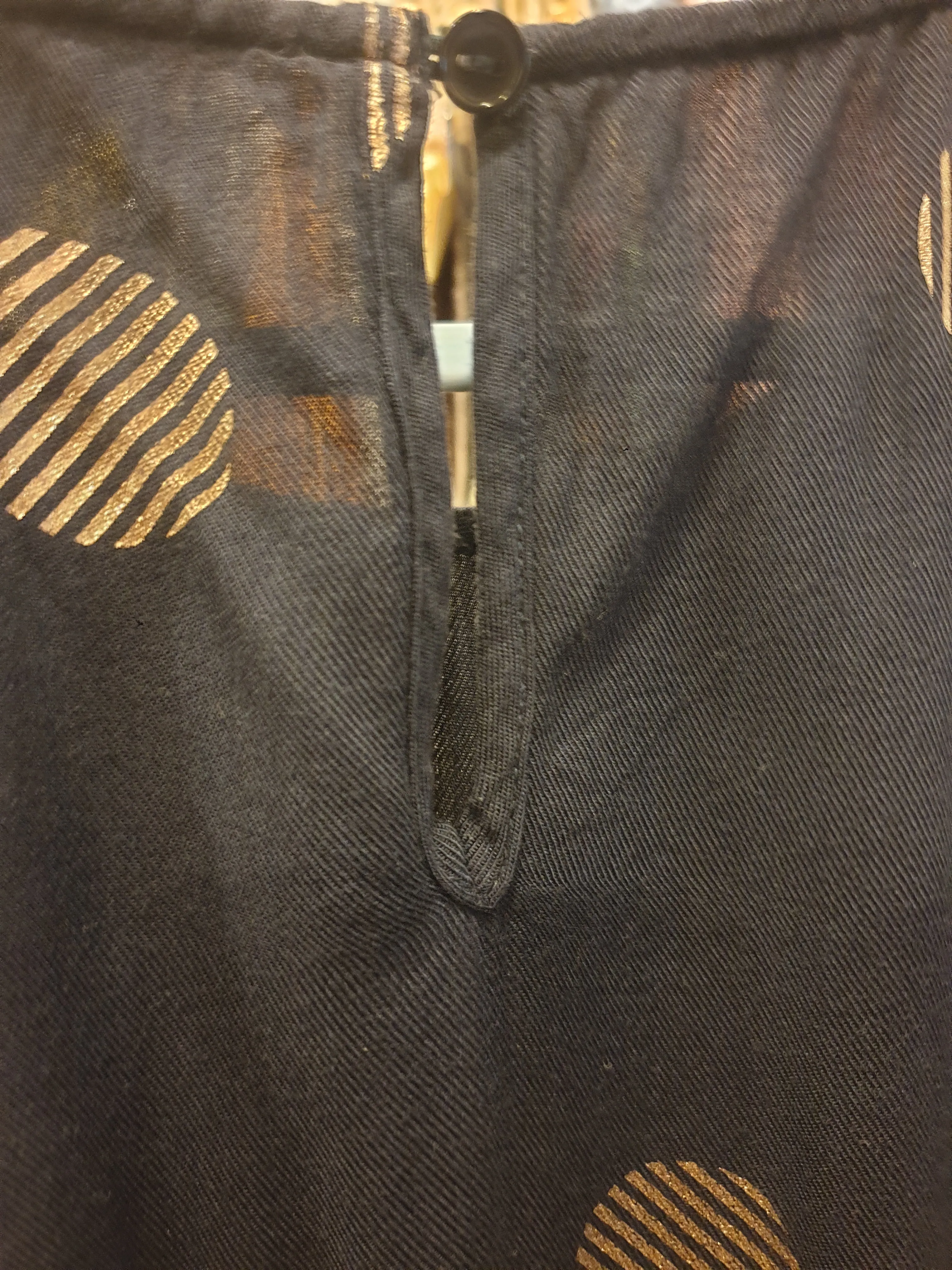 Navy top with lovely gold polka dots best fits size 10