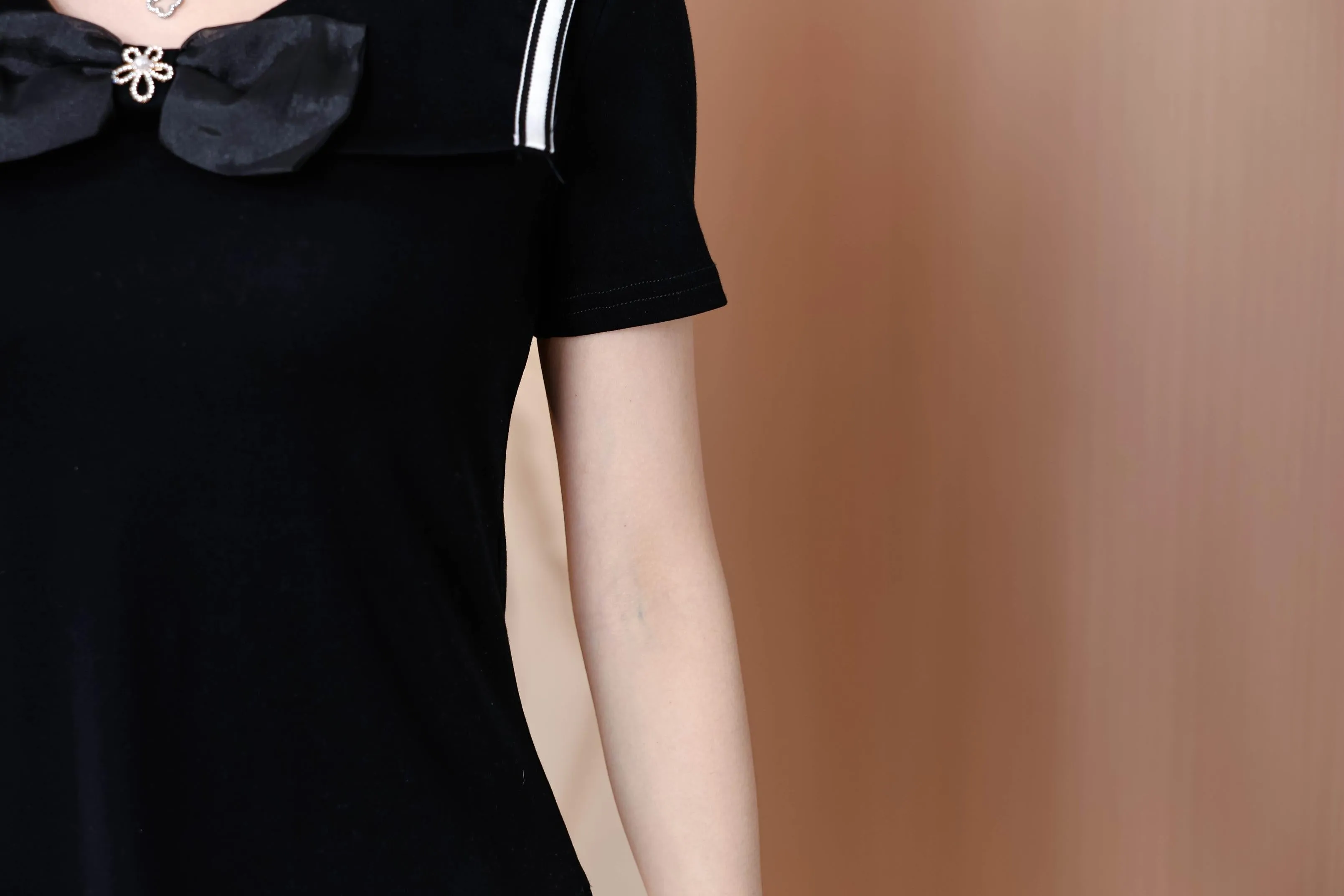 Women's Fitted T-Shirt Featuring a Chic Bow Tie Neckline